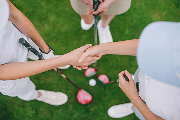 overhead view of golfers shaking hands
