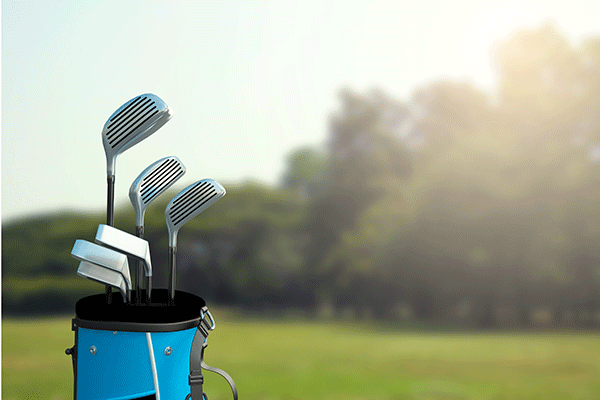 Golf equipment outside in the sun.